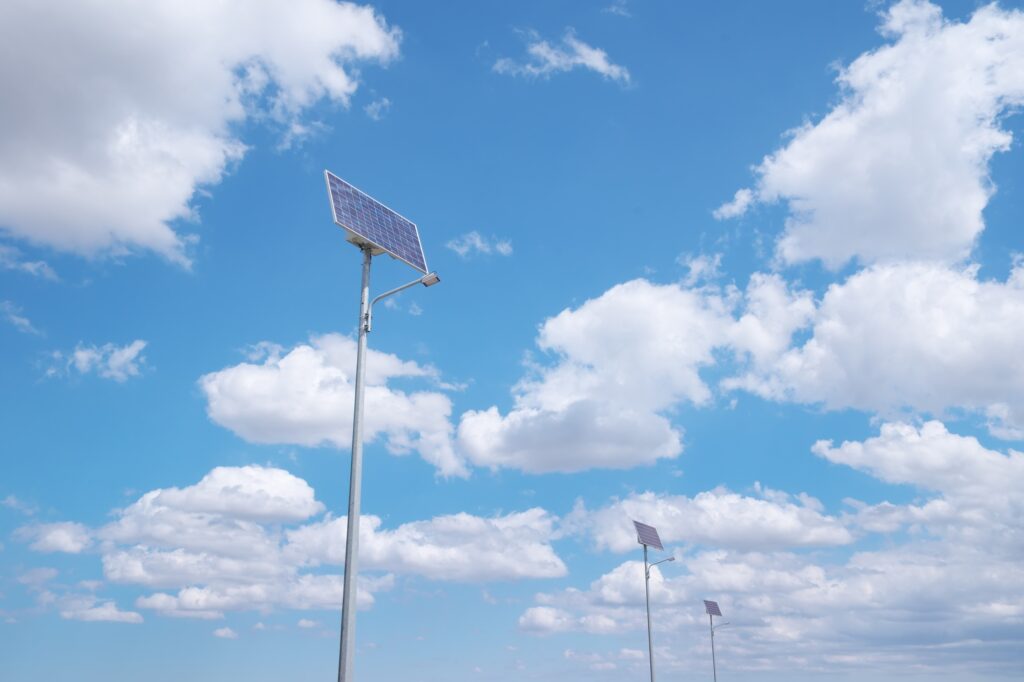 Lamp post and solar energy on deep blue sky background.